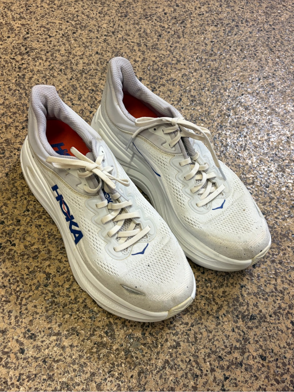 Hoka Men's White Athletic Shoes with Blue Logo and Orange Lining